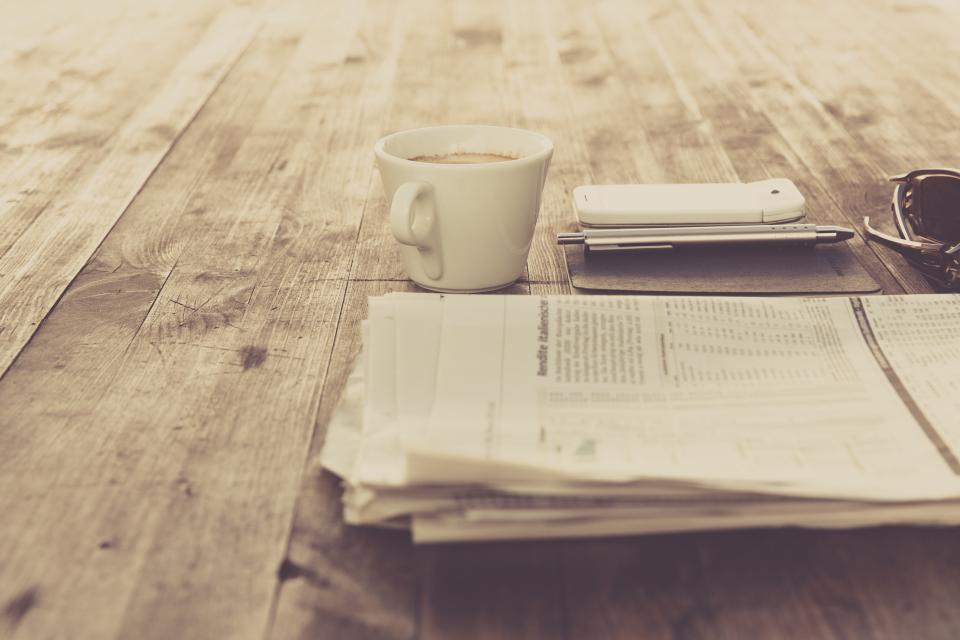 An itemized medical bill and an insurance explanation of benefits on a desk